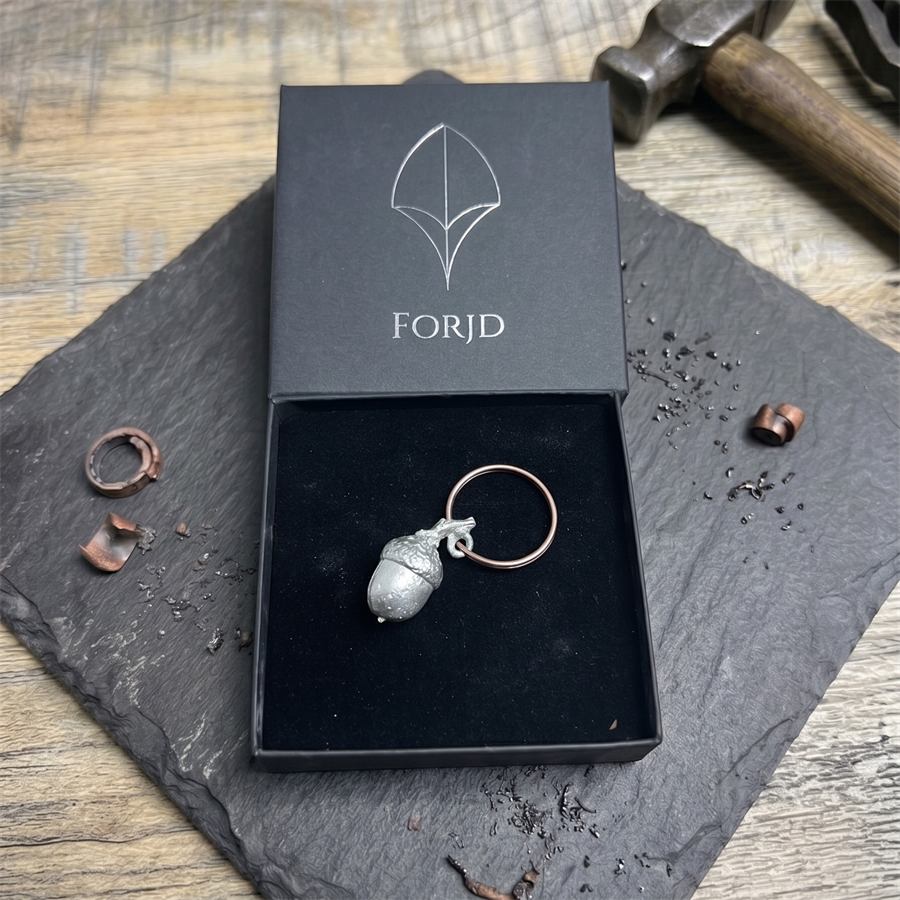 A pewter acorn keyring, boxed