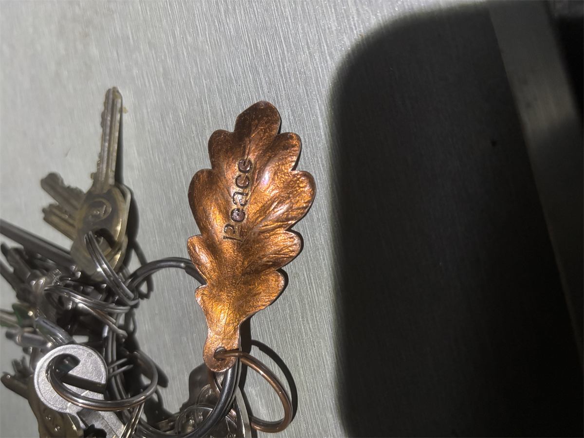 A hand finished copper leaf keyring